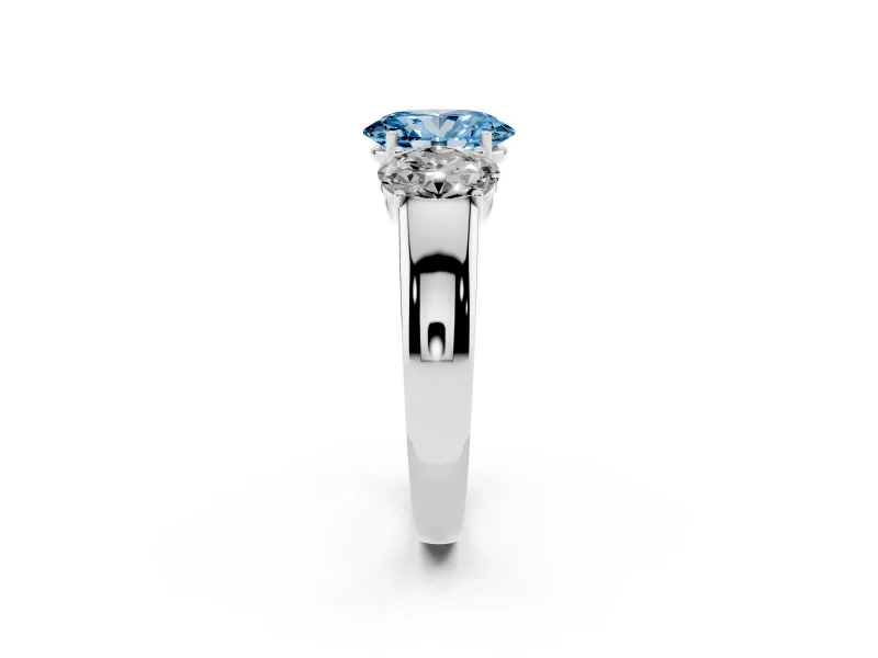 Fancy Blue Three-Stone Oval Cut Diamond Ring Set in Platinum with Matching Prong Settings and Plain Band