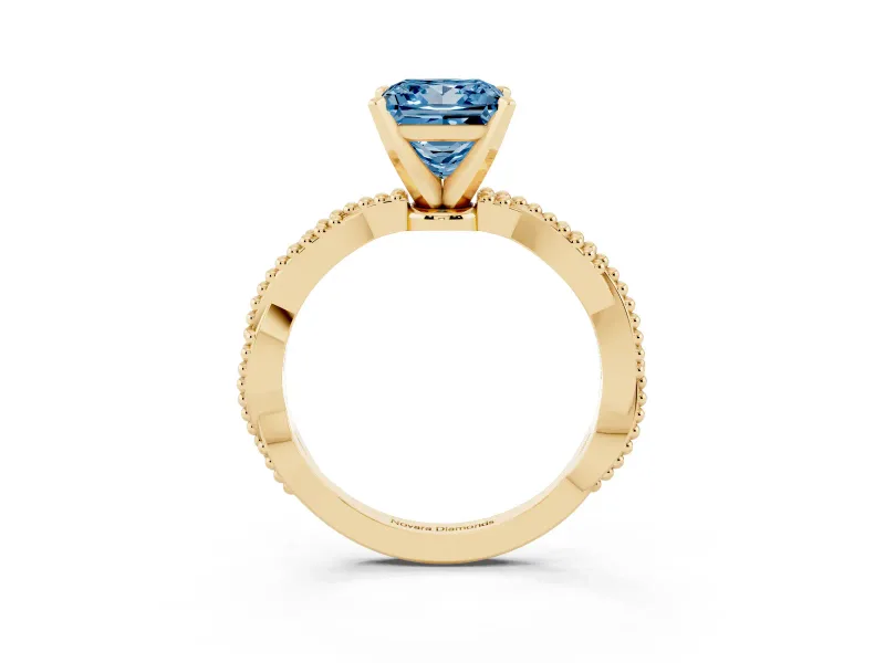 Fancy Blue Princess Cut Diamond Solitaire Ring Set in Yellow gold with Twisted Band and Bead Prong Setting
