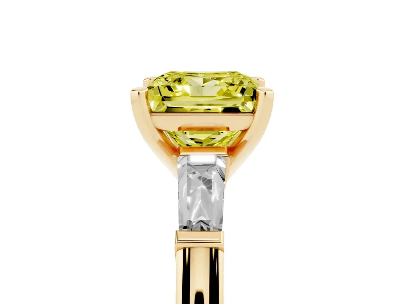 Fancy Yellow Princess Cut Diamond Solitaire Ring Set in Yellow gold with Tapered Baguette Side Stones and Prong Setting