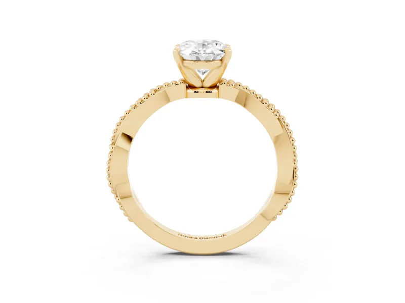 Oval Cut Diamond Solitaire Ring Set in Yellow gold with Twisted Band and Bead Prong Setting