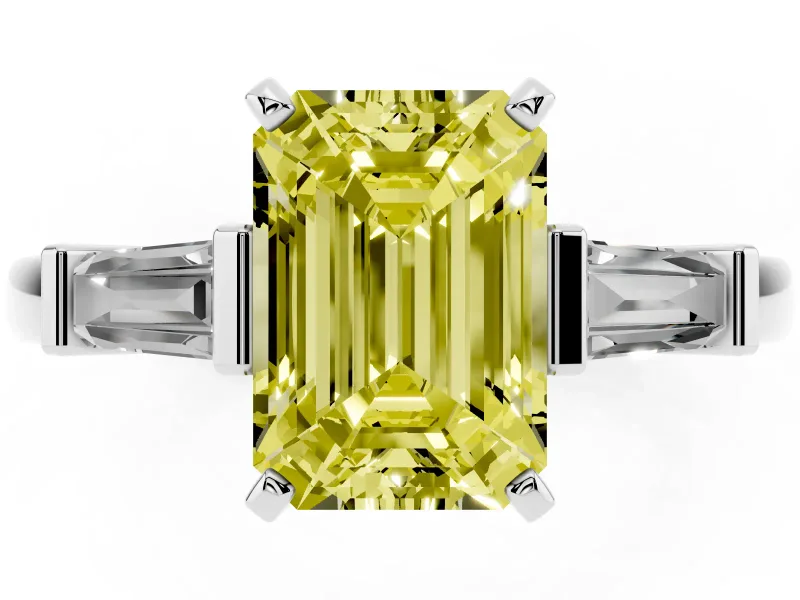 Fancy Yellow Emerald Cut Diamond Solitaire Ring Set in White gold with Tapered Baguette Accents and Prong Setting