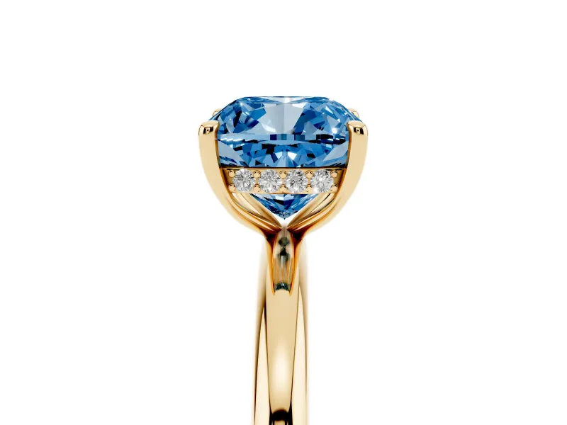 Fancy Blue Cushion Cut Diamond Solitaire Ring Set in Yellow gold with Thin Band and Prong Setting