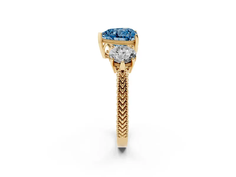 Fancy Blue Heart Cut Diamond Three-Stone Ring Set in Yellow gold with Milgrain Band