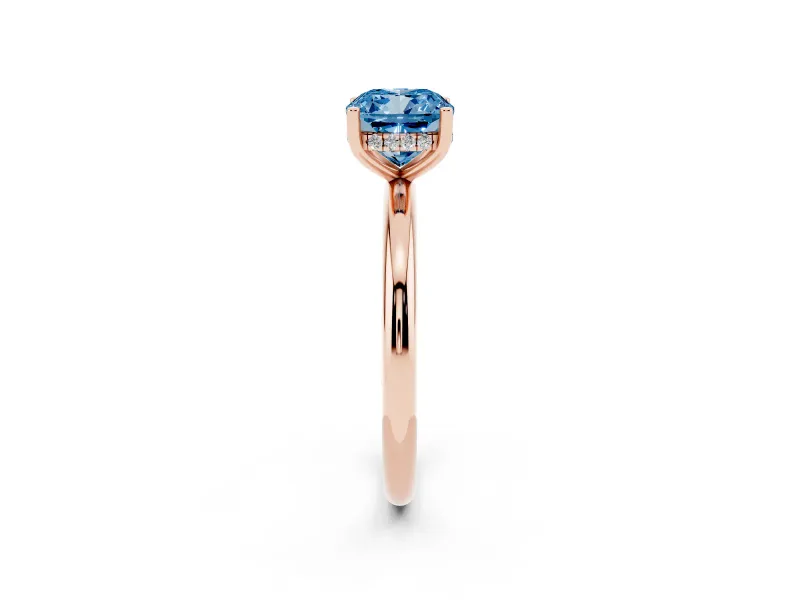 Fancy Blue Cushion Cut Diamond Solitaire Engagement Ring Set in Rose gold with Prong Setting and Polished Band