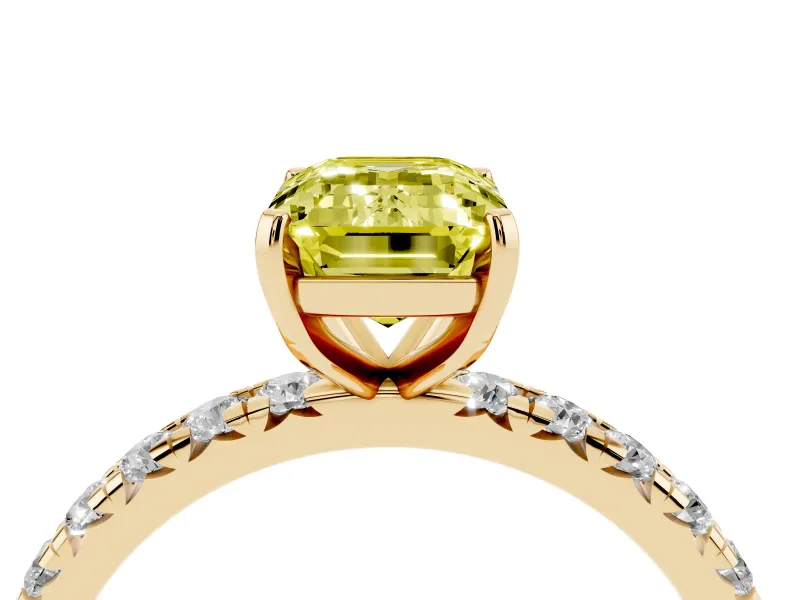 Fancy Yellow Emerald Cut Diamond Pavé Solitaire Ring Set in Yellow gold with Round Band and Prong Setting