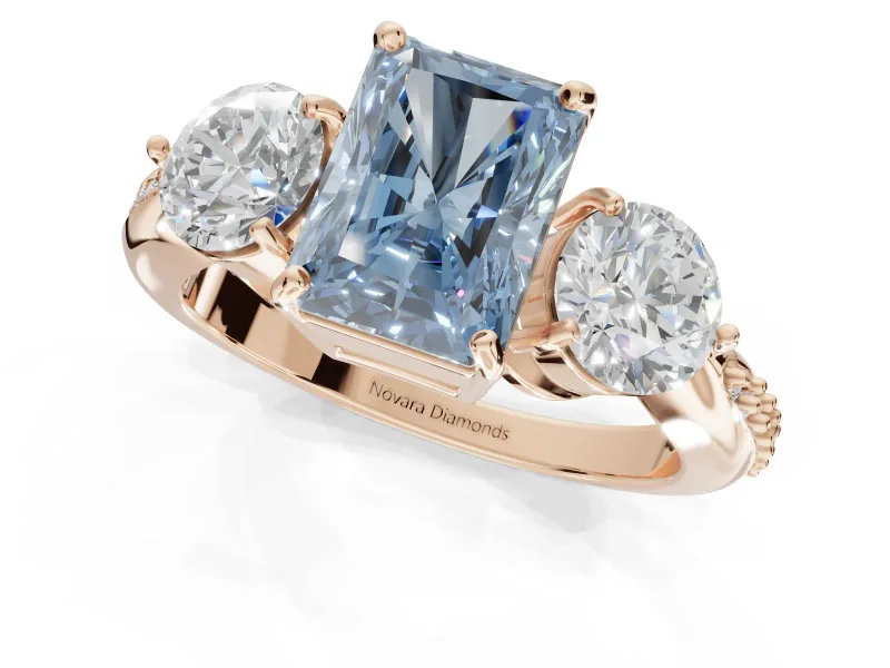 Radiant Cut Three Stone Engagement Ring Setting for a Fancy Blue Lab-Grown Diamond | Tapered Pave Band | Rose Gold