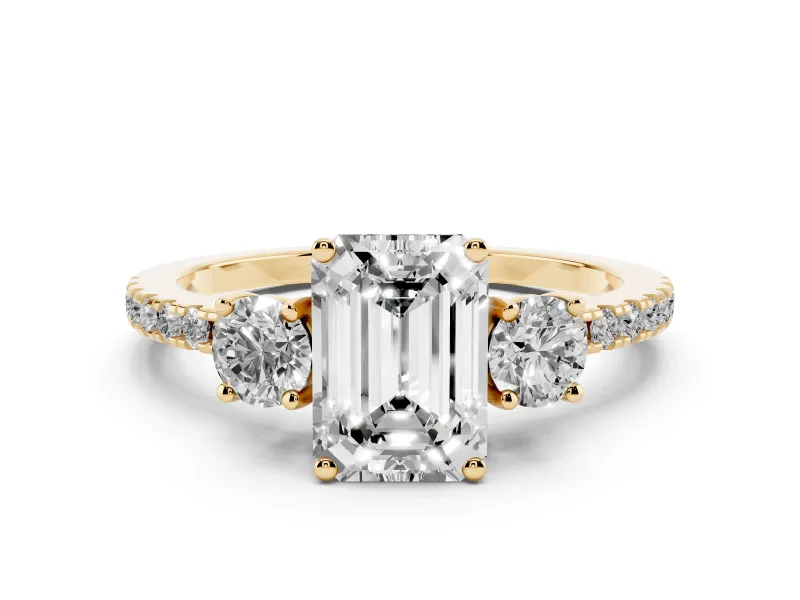 Emerald Cut Diamond Three-Stone Ring Set in Yellow gold with Pavé Band and Graduated Sides