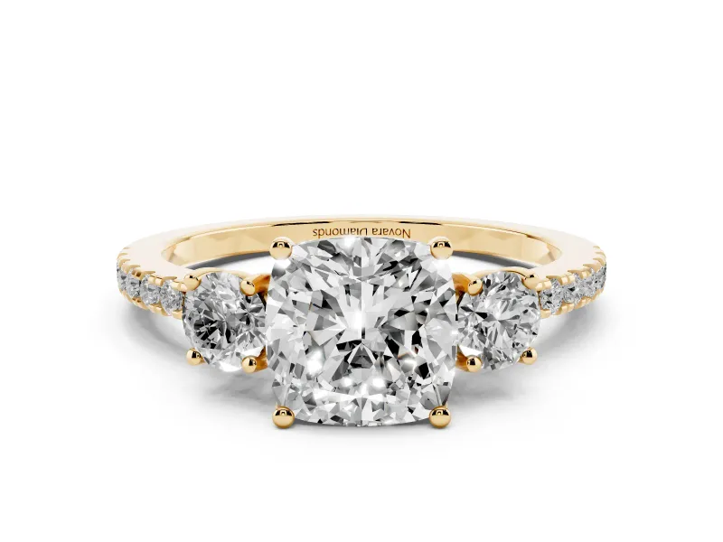 Cushion Cut Diamond Three-Stone Ring Set in Yellow gold with Pavé Band and Graduated Sides