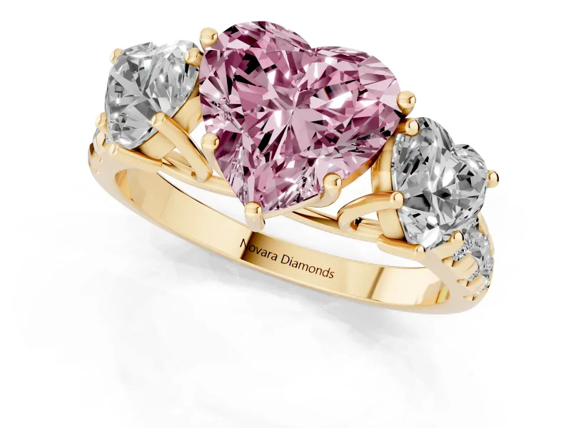 Fancy Pink Heart Cut Diamond Three-Stone Ring Set in Yellow gold with Pavé Band