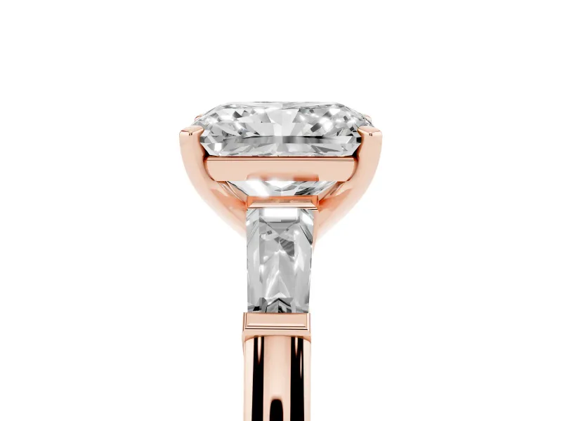 Radiant Cut Diamond Solitaire Ring Set in Rose gold with Tapered Baguette Side Stones and Prong Setting