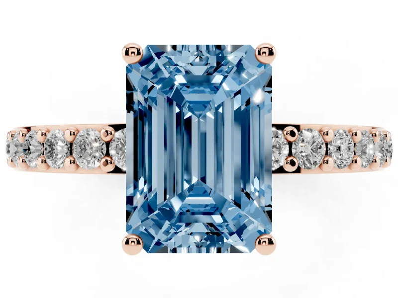 Fancy Blue Emerald Cut Diamond Solitaire Set in Rose gold with Round Pavé Band and Prong Setting