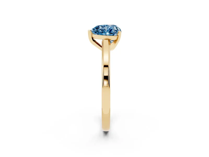 Fancy Blue Heart Cut Diamond Solitaire Ring Set in Yellow gold with Prong Setting and Classic Band