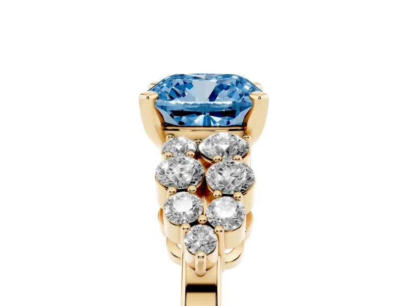 Fancy Blue Cushion Cut Diamond Cluster Engagement Ring Set in Yellow gold with Pavé Band and Prong Setting