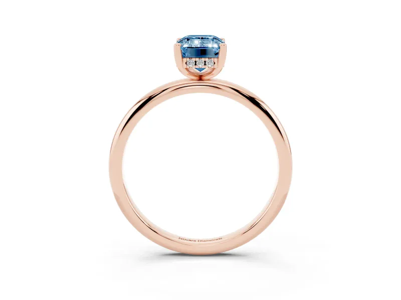 Fancy Blue Emerald Cut Diamond Solitaire Engagement Ring Set in Rose gold with Prong Setting and Polished Band