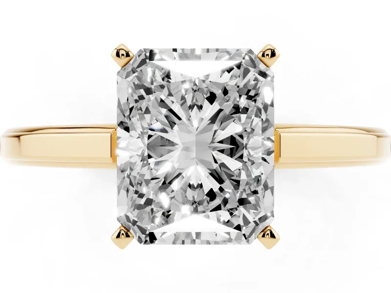 Radiant Cut Diamond Solitaire Ring Set in Yellow gold with Prong Setting and Classic Band