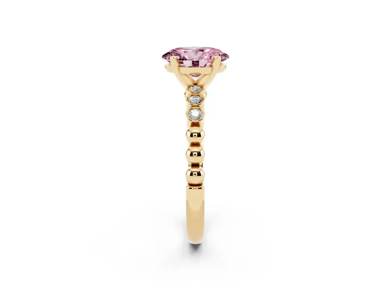 Fancy Pink Oval Cut Diamond Solitaire Engagement Ring Set in Yellow gold with Bezel Accents on Beaded Band