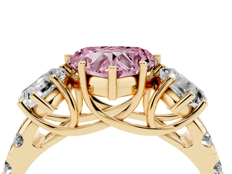 Fancy Pink Heart Cut Diamond Three-Stone Ring Set in Yellow gold with Pavé Band