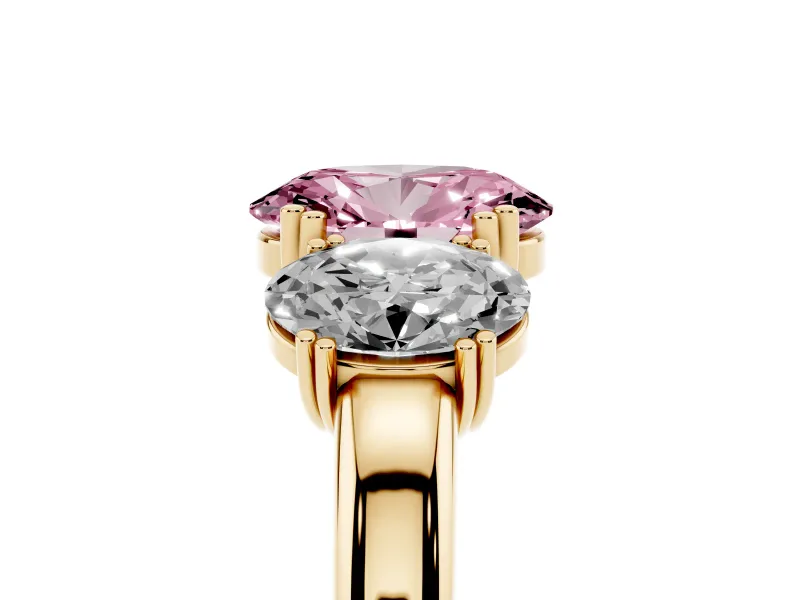 Fancy Pink Oval Cut Diamond Three-Stone Ring Set in Yellow gold with Polished Band and Prong Setting