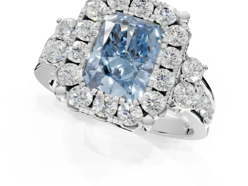 Radiant Cut Halo Engagement Ring Setting for a Fancy Blue Lab-Grown Diamond | Graduated Channel Band | Platinum
