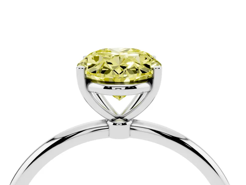 Fancy Yellow Oval Cut Diamond Solitaire Engagement Ring Set in White gold with Thin Band and Prong Setting