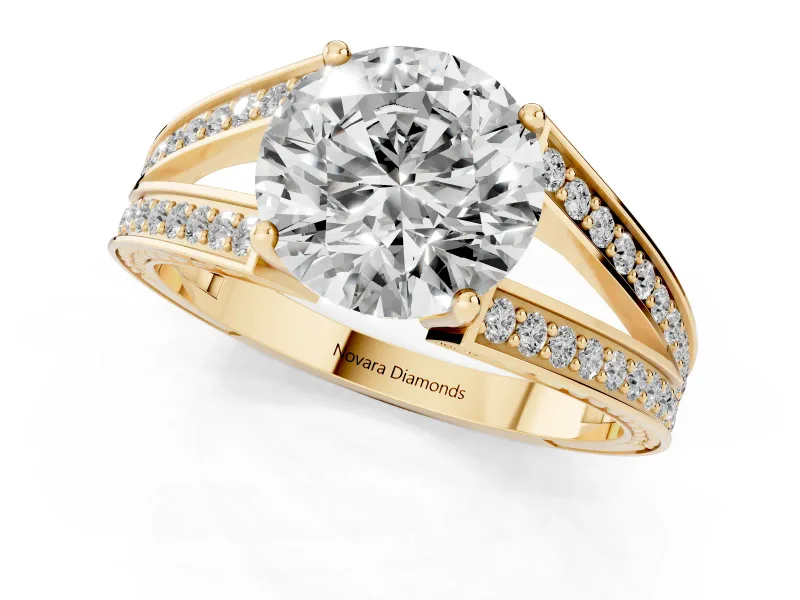 Round Cut Diamond Split Shank Ring Set in Yellow gold with Pavé Band and Prong Setting