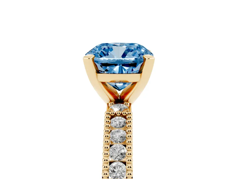 Fancy Blue Cushion Cut Diamond Solitaire Ring Set in Yellow gold with Slim Pavé Band and Prong Setting