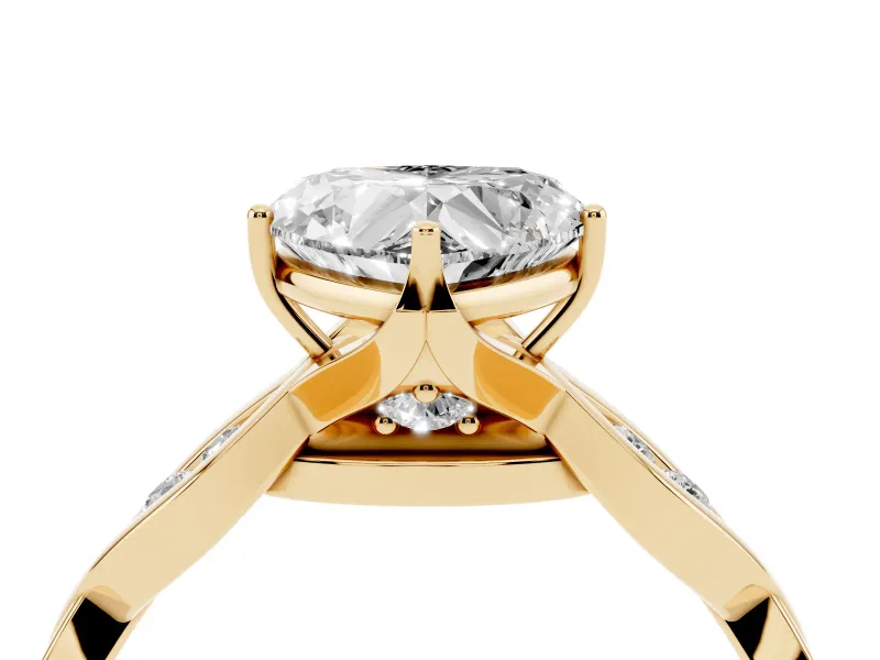 Heart Cut Diamond Twist Band Solitaire Ring Set in Yellow gold with Leaf Prong Setting and Accent Stones