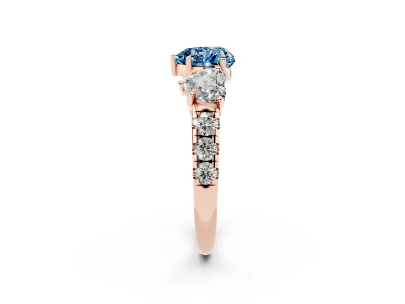 Fancy Blue Heart Cut Diamond Three-Stone Ring Set in Rose gold with Pavé Band