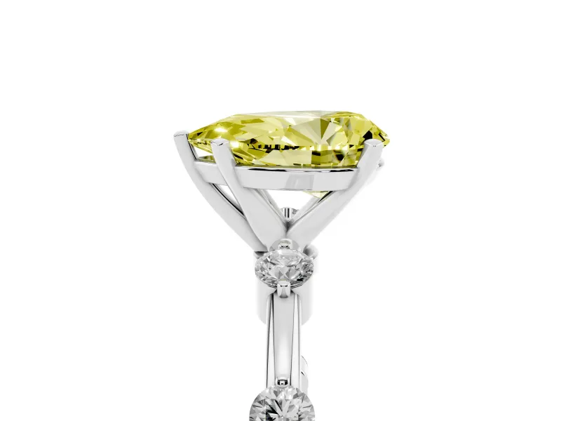 Fancy Yellow Pear Cut Diamond Solitaire Ring Set in Platinum with Bezel Set Side Stones and Prong Setting