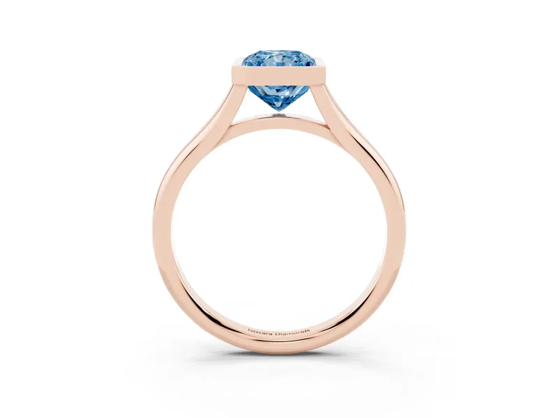 Fancy Blue Bezel Set Radiant Cut Diamond Solitaire Ring Set in Rose gold with Tapered Band