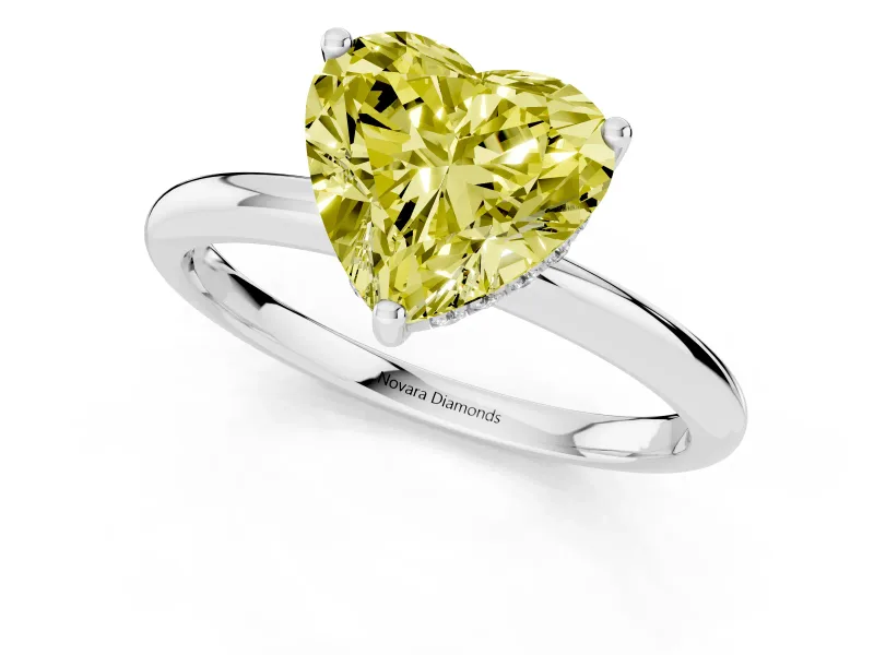 Fancy Yellow Heart Cut Diamond Solitaire Engagement Ring Set in White gold with Prong Setting and Polished Band