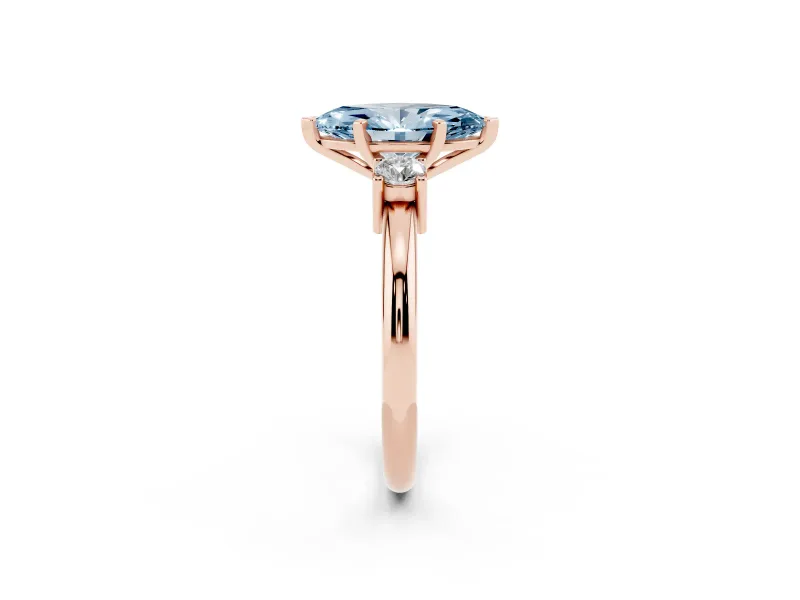 Fancy Blue Three-Stone Marquise Cut Diamond Ring Set in Rose gold with Prong Setting and Plain Band