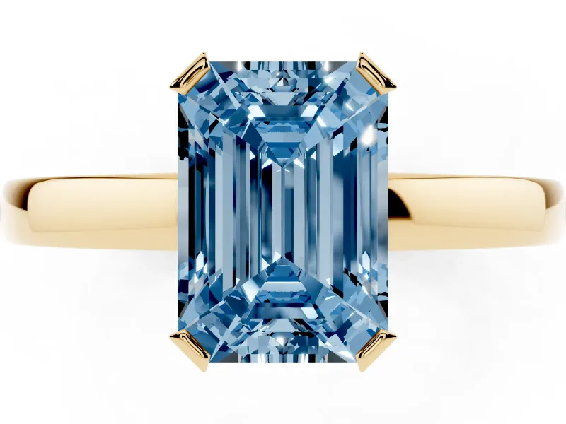 Fancy Blue Emerald Cut Diamond Solitaire Ring Set in Yellow gold with Prong Head and Smooth Polished Band