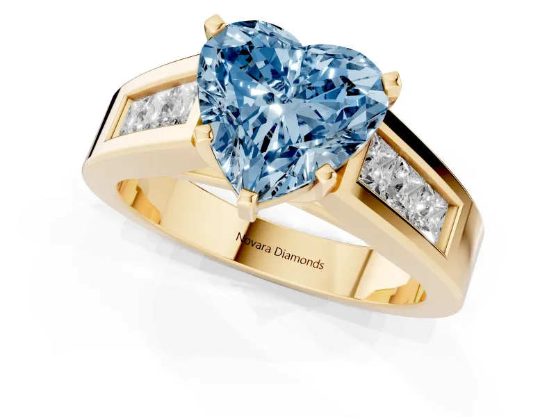 Fancy Blue Heart Cut Diamond Solitaire Ring Set in Yellow gold with Channel-Set Accent Stones and Prong Setting