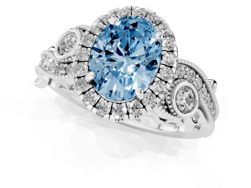 Fancy Blue Oval Cut Diamond Halo Ring Set in White gold with Milgrain Pavé Band and Prong Setting