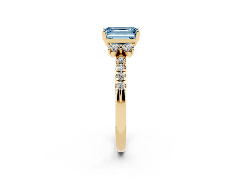 Emerald Cut Side Stone Engagement Ring Setting for a Fancy Blue Lab-Grown Diamond | Pave Band | Yellow Gold