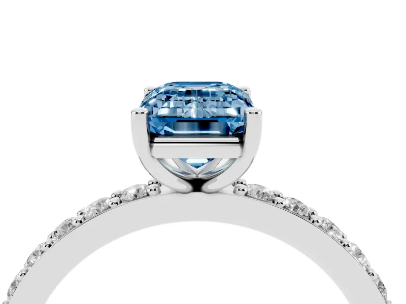 Fancy Blue Emerald Cut Diamond Solitaire Set in White gold with Round Pavé Band and Prong Setting
