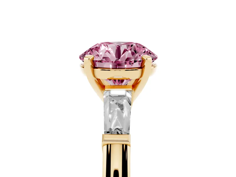 Fancy Pink Round Cut Diamond Solitaire Ring Set in Yellow gold with Tapered Baguette Side Stones and Prong Setting