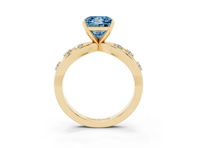 Fancy Blue Princess Cut Diamond Solitaire Ring Set in Yellow gold with Side Stones on Criss-Cross Band and Prong Setting