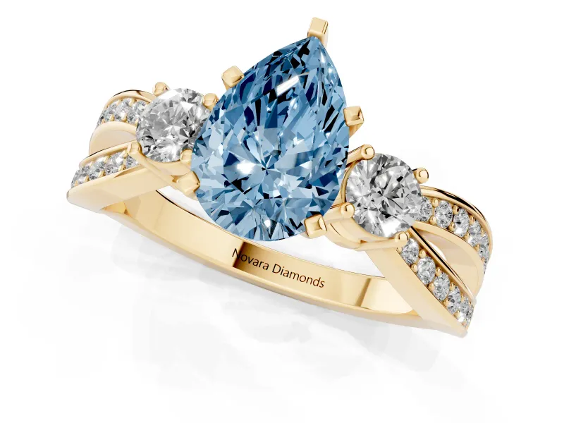 Fancy Blue Three-Stone Pear Cut Diamond Twist Band Ring Set in Yellow gold with Pavé Accents and Prong Setting
