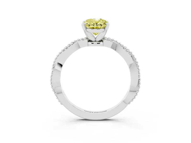 Fancy Yellow Oval Cut Diamond Solitaire Ring Set in White gold with Twisted Band and Bead Prong Setting