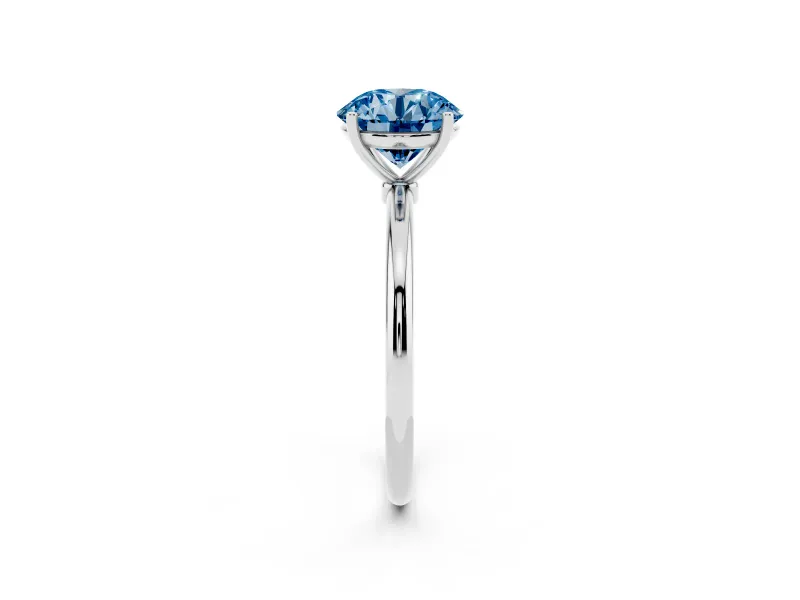 Fancy Blue Round Cut Diamond Solitaire Engagement Ring Set in Silver with Thin Band and Prong Setting