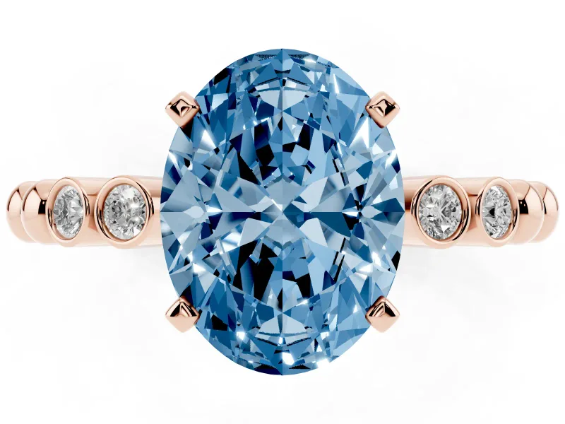 Fancy Blue Oval Cut Diamond Solitaire Engagement Ring Set in Rose gold with Bezel Accents on Beaded Band