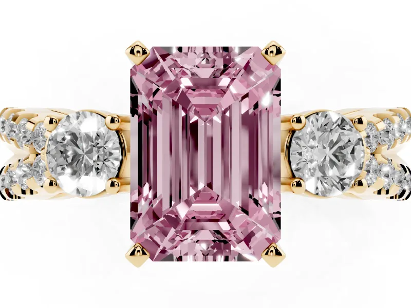 Fancy Pink Emerald Cut Diamond Three-Stone Ring Set in Yellow gold with Pavé Split Shank and Prong Setting