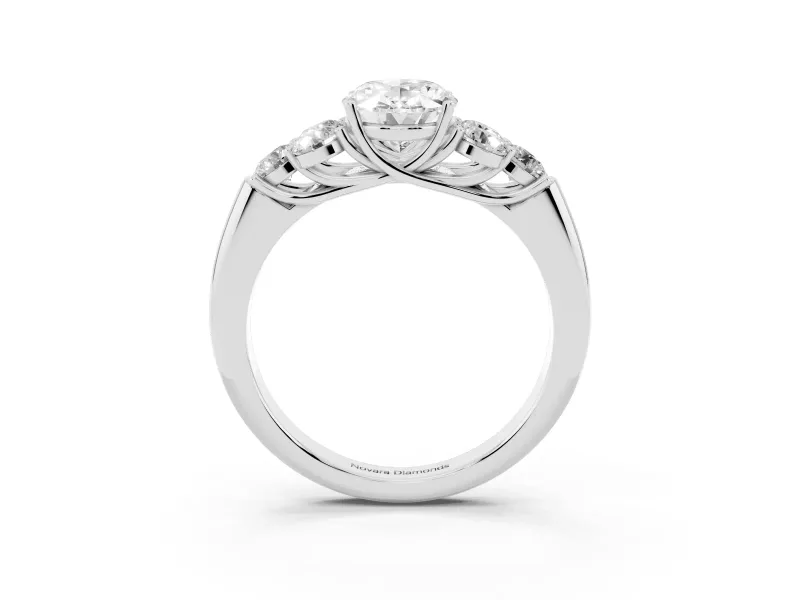 Oval Cut Diamond Cluster Ring Set in Silver with Round Accent Stones and Prong Setting on a Plain Band