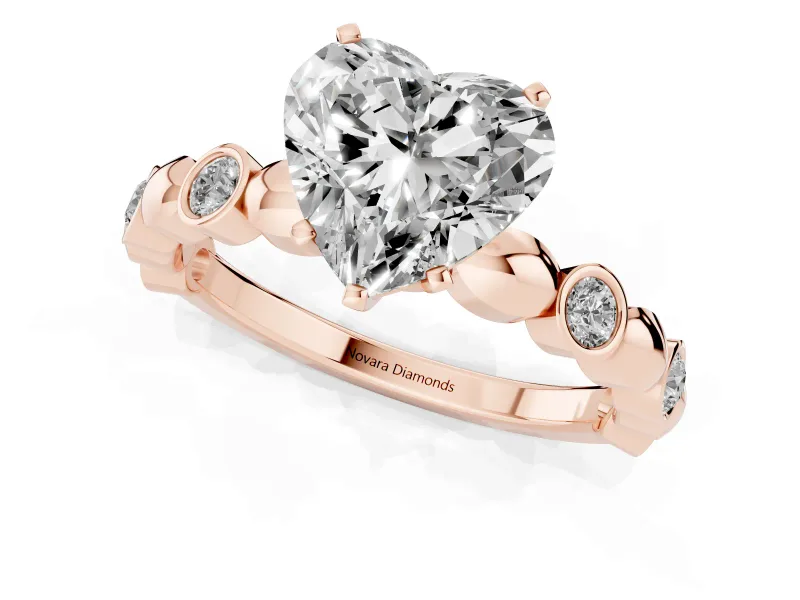 Heart Cut Diamond Solitaire Ring Set in Rose gold with Bezel-Set Accents on Beaded Band and Prong Setting