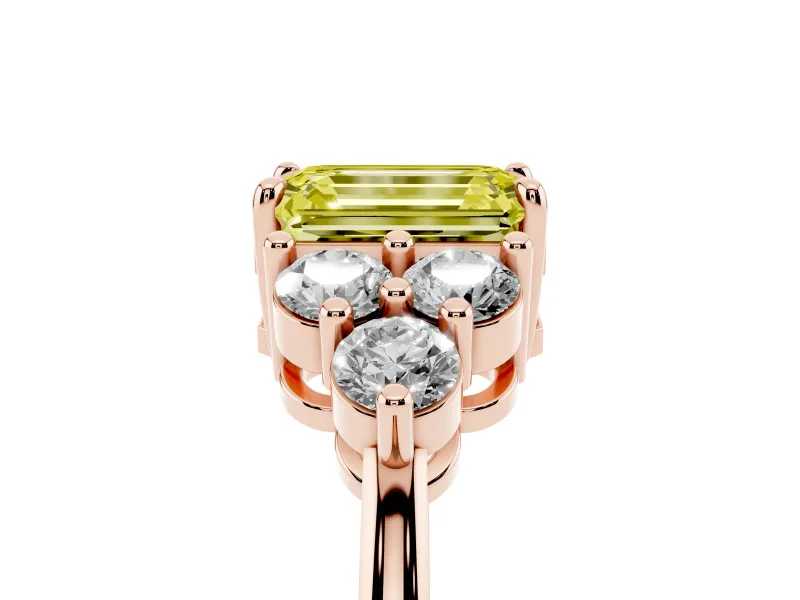 Fancy Yellow Emerald Cut Diamond Solitaire Ring Set in Rose gold with Cluster Accents on Each Side