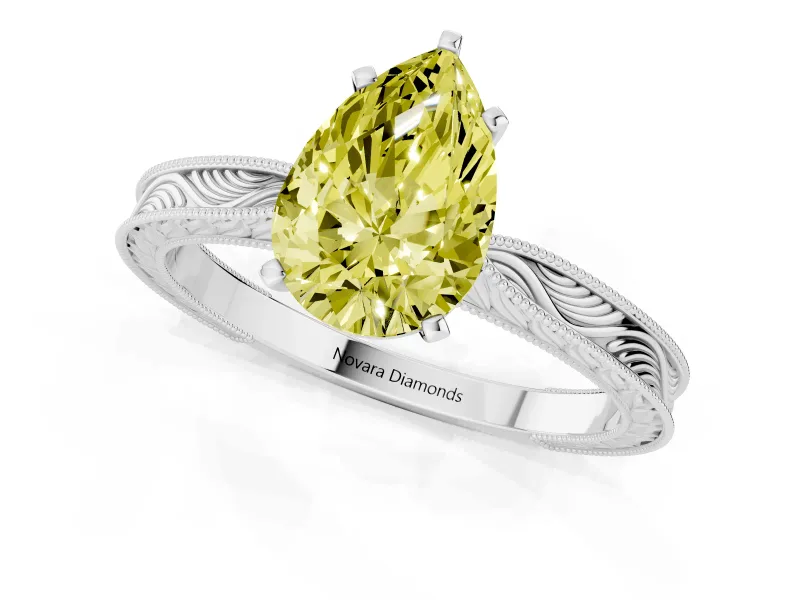 Fancy Yellow Pear Cut Diamond Solitaire Milgrain Engraved Band Set in Silver with Prong Setting