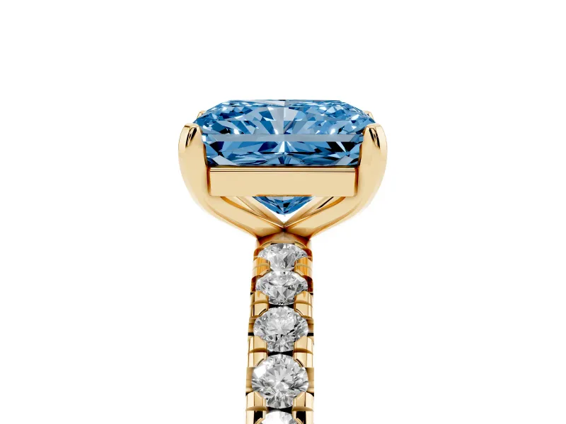 Fancy Blue Radiant Cut Diamond Pavé Solitaire Ring Set in Yellow gold with Round Band and Prong Setting