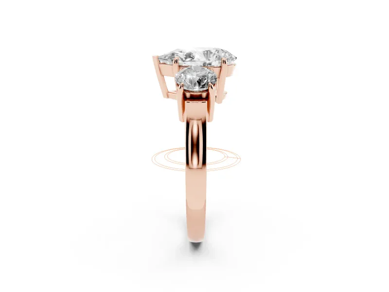 Pear Cut Diamond Three-Stone Ring Set in Rose gold with Round Accent Stones and Plain Band